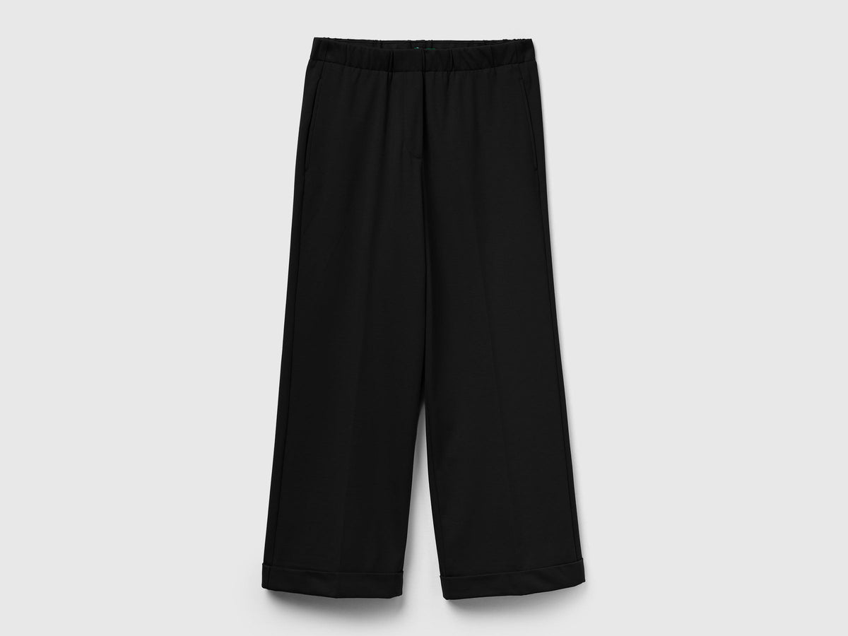 Pantaloni con elastico in vita e risvolto