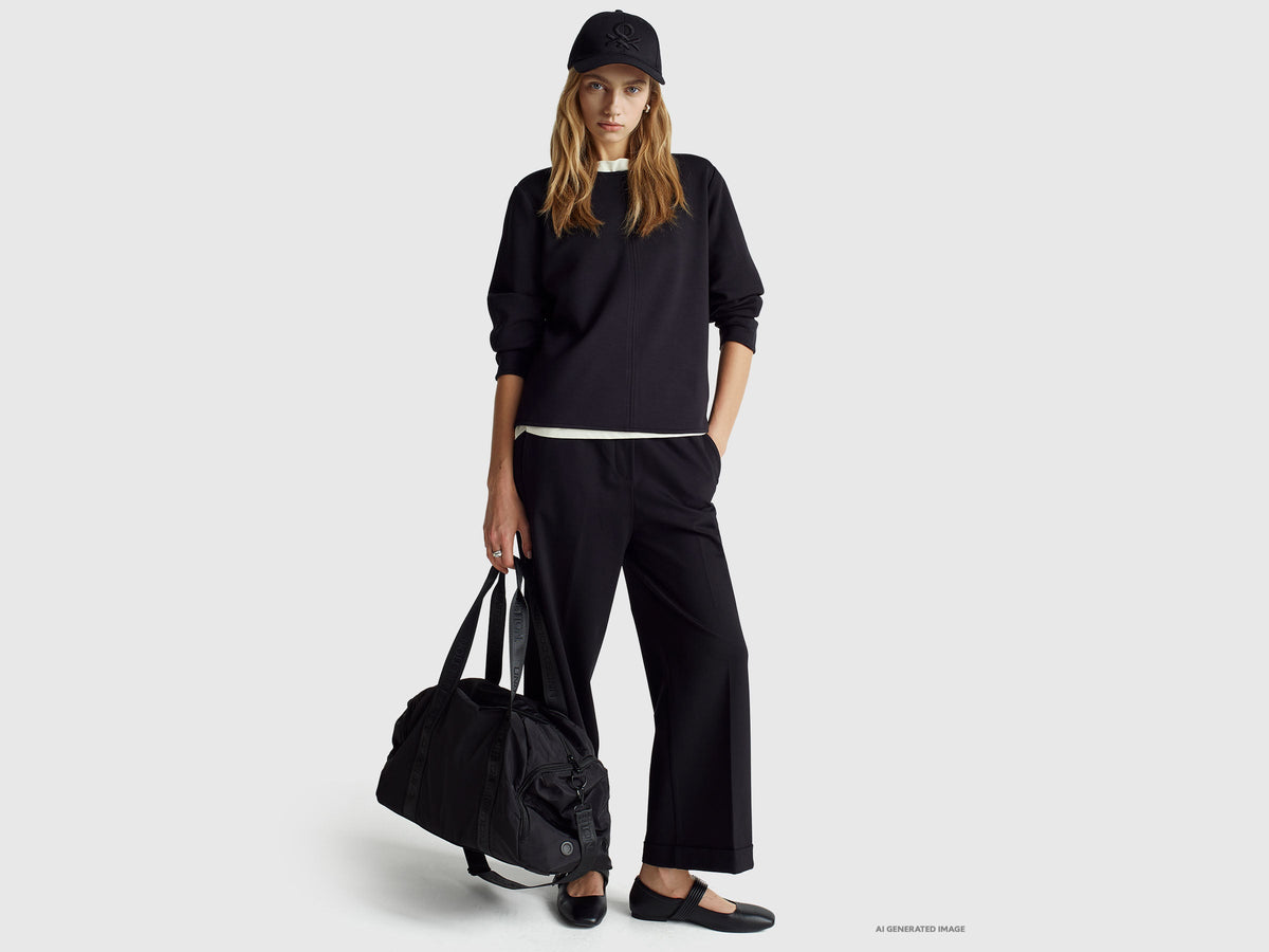 Pantaloni con elastico in vita e risvolto
