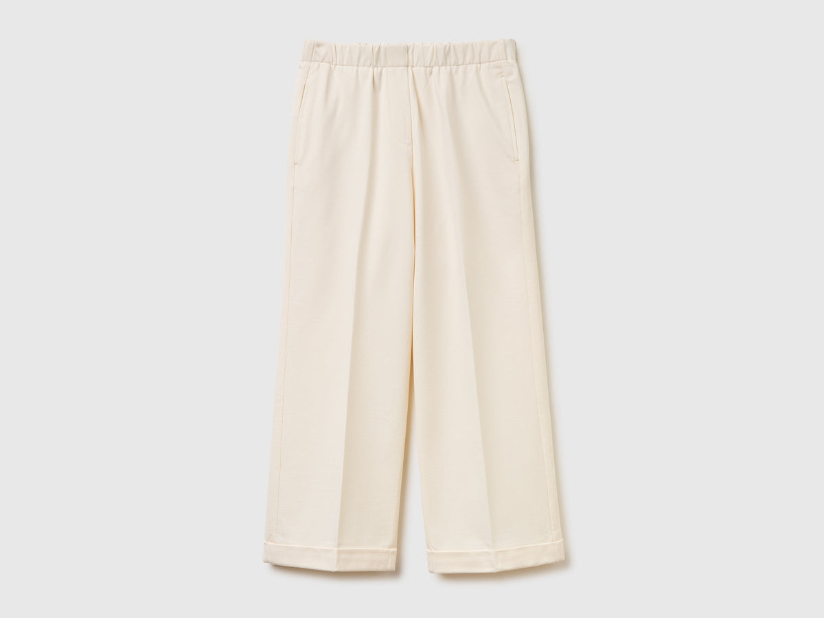 Pantaloni con elastico in vita e risvolto