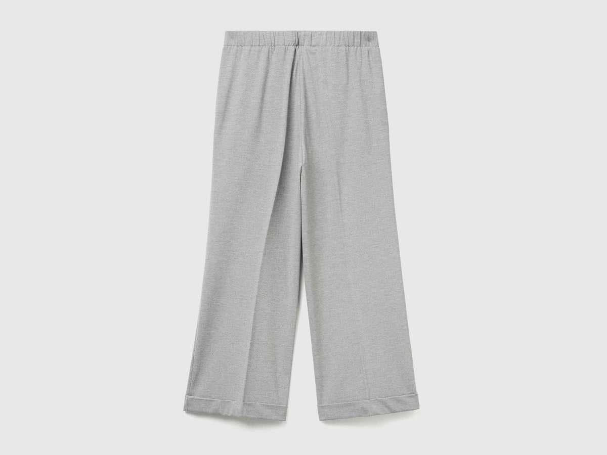 Pantaloni con elastico in vita e risvolto
