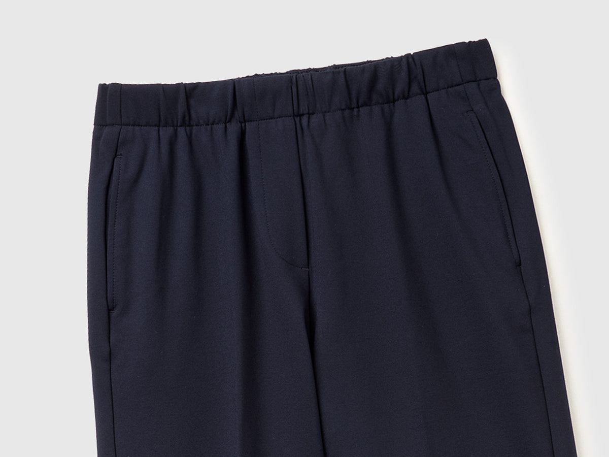 Pantaloni con elastico in vita e risvolto