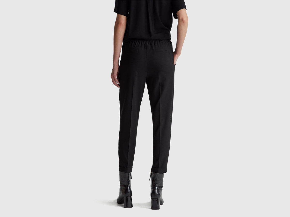 Pantaloni con risvolto in misto viscosa stretch