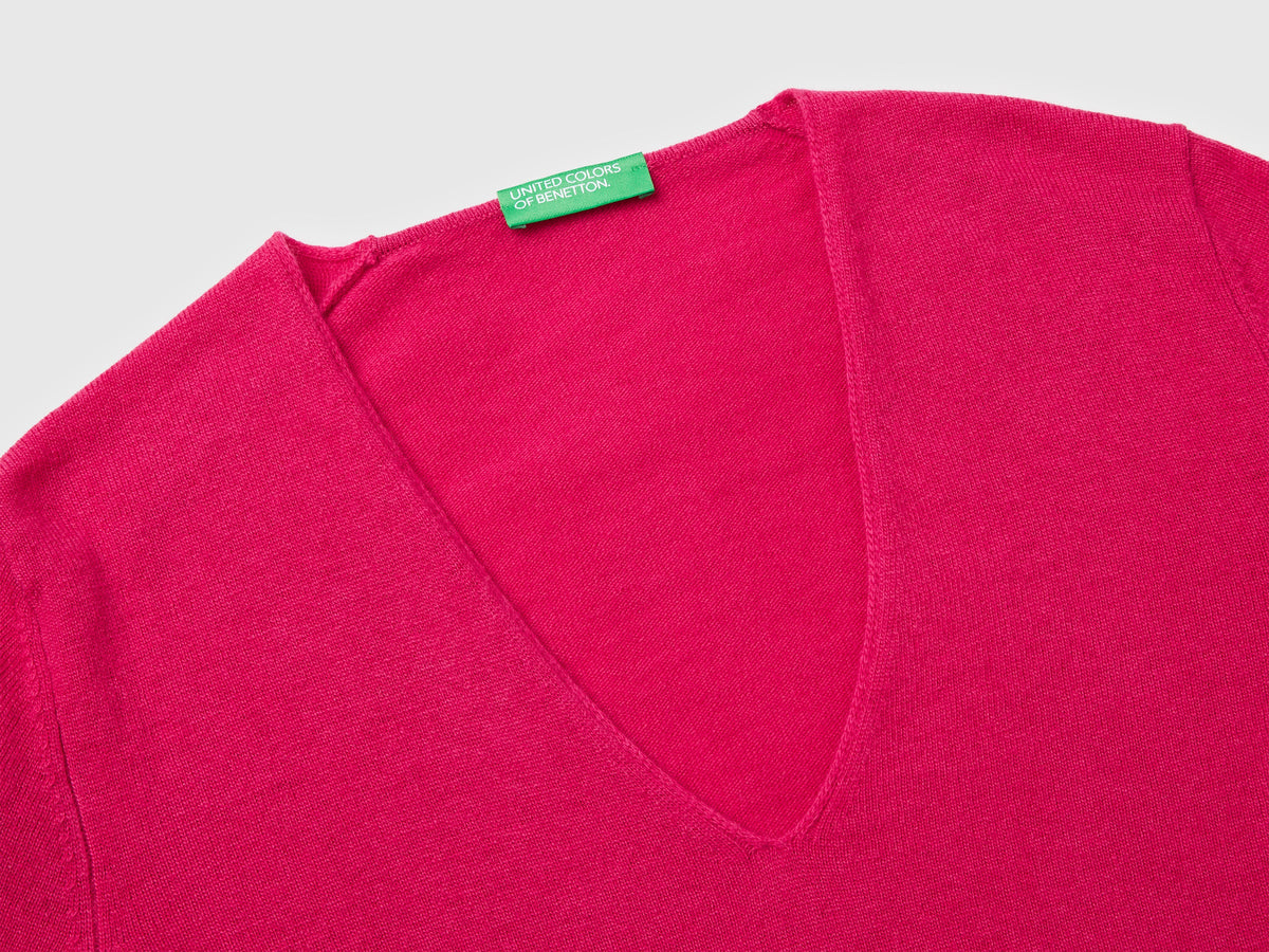 Maglione fucsia con scollo a V in pura lana Merino