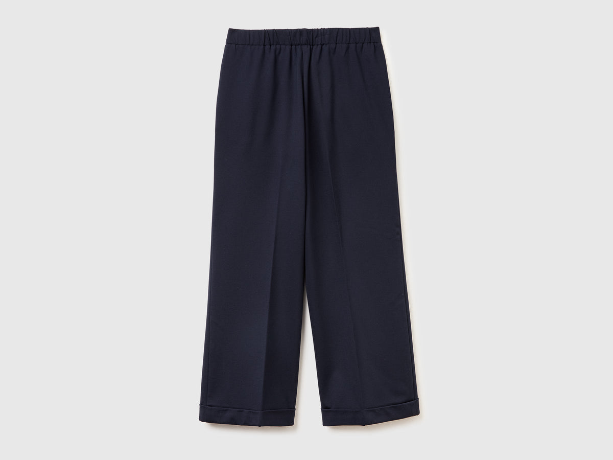 Pantaloni con elastico in vita e risvolto
