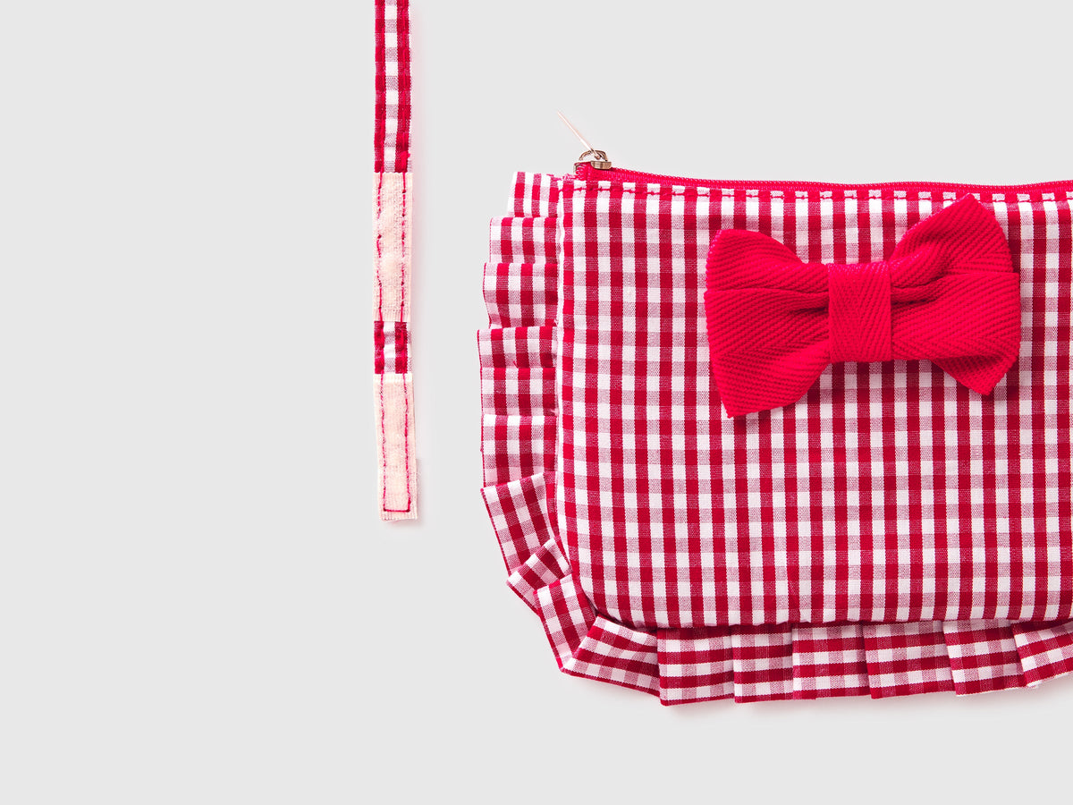 Borsa con rouches e fiocco