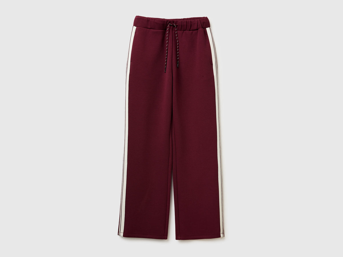 Pantaloni con bande laterali rigate