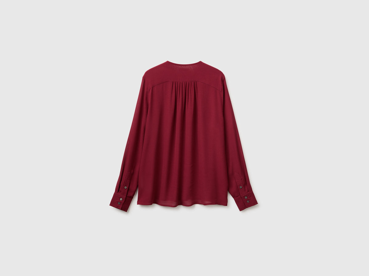 Blusa fluida con laccetto