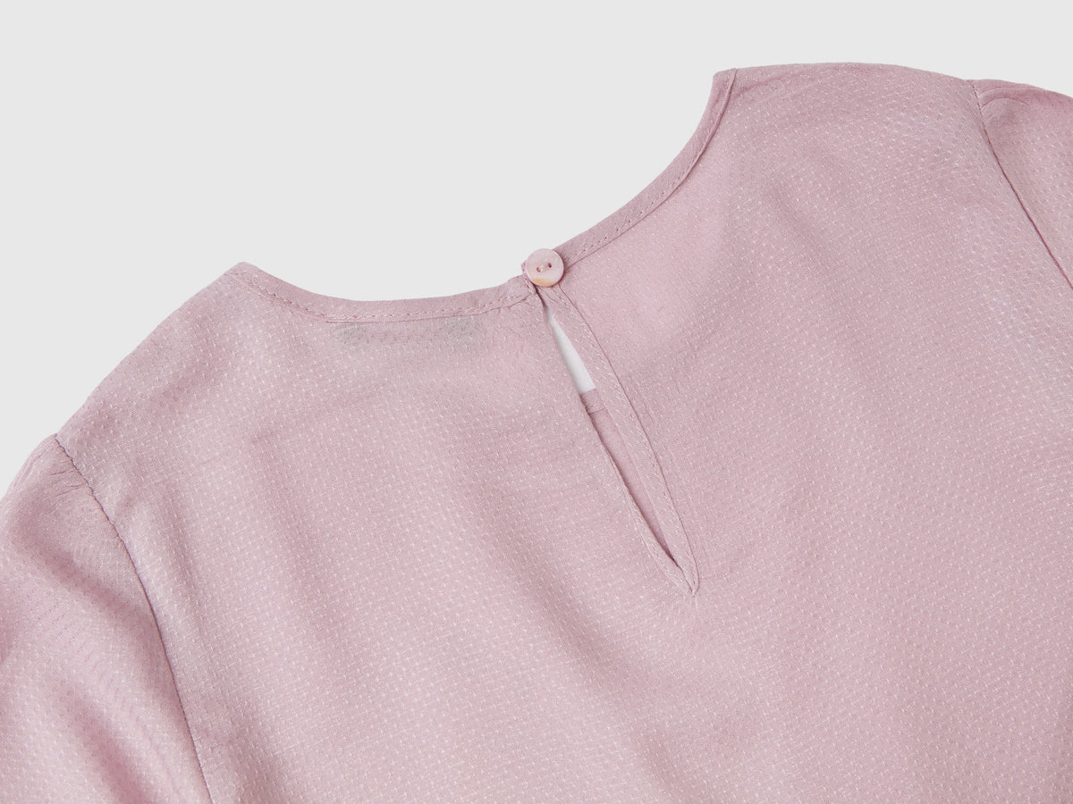 Blusa cropped con nodo
