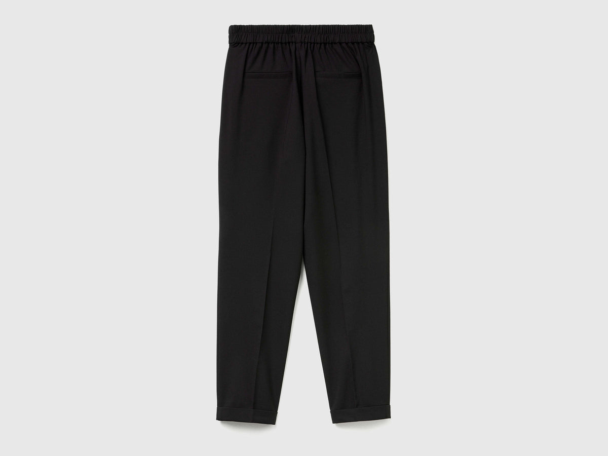 Pantaloni con risvolto in misto viscosa stretch