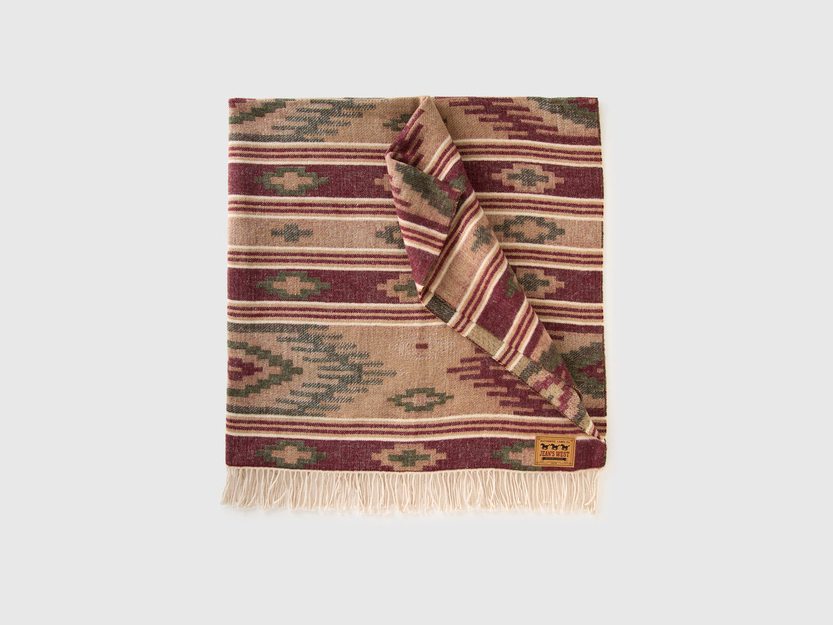 Coperta jacquard con frange