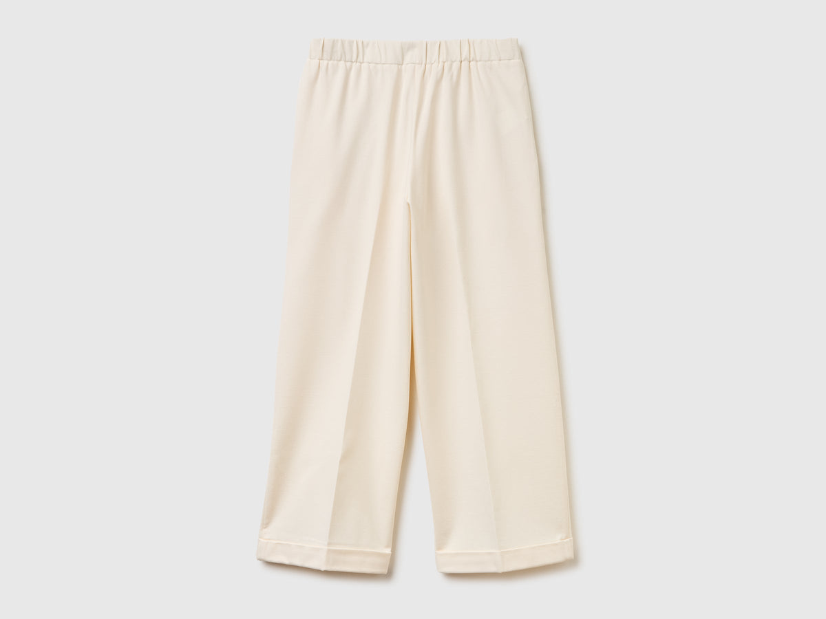 Pantaloni con elastico in vita e risvolto