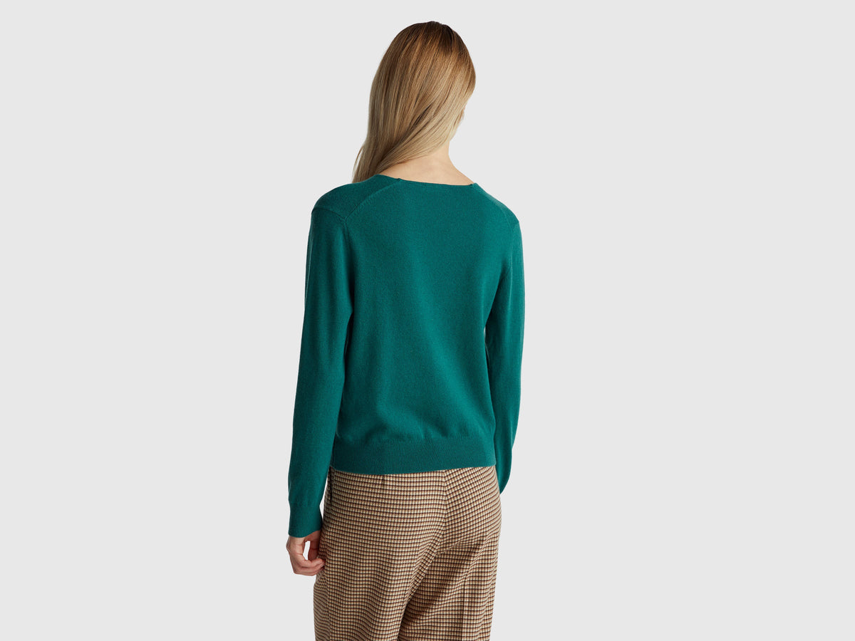 Maglione verde con scollo a V in pura lana Merino
