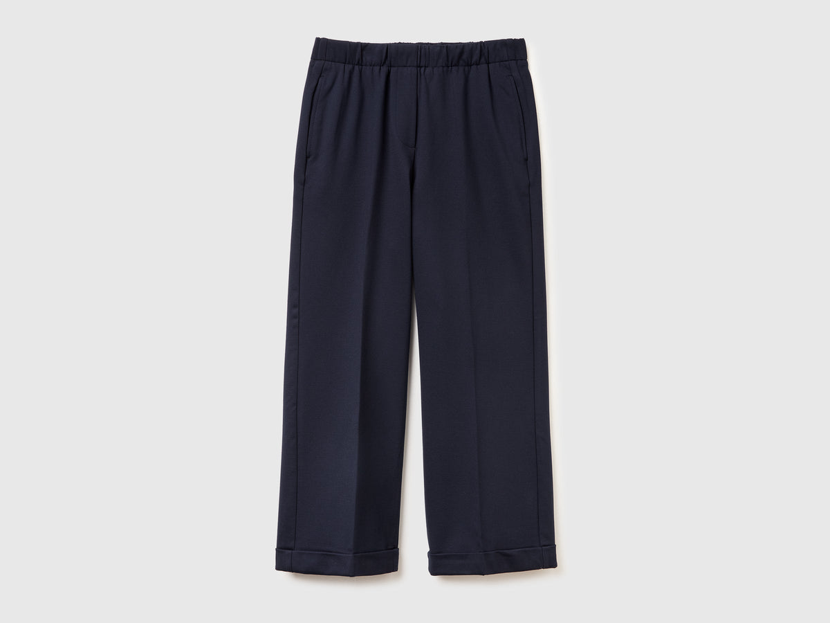 Pantaloni con elastico in vita e risvolto