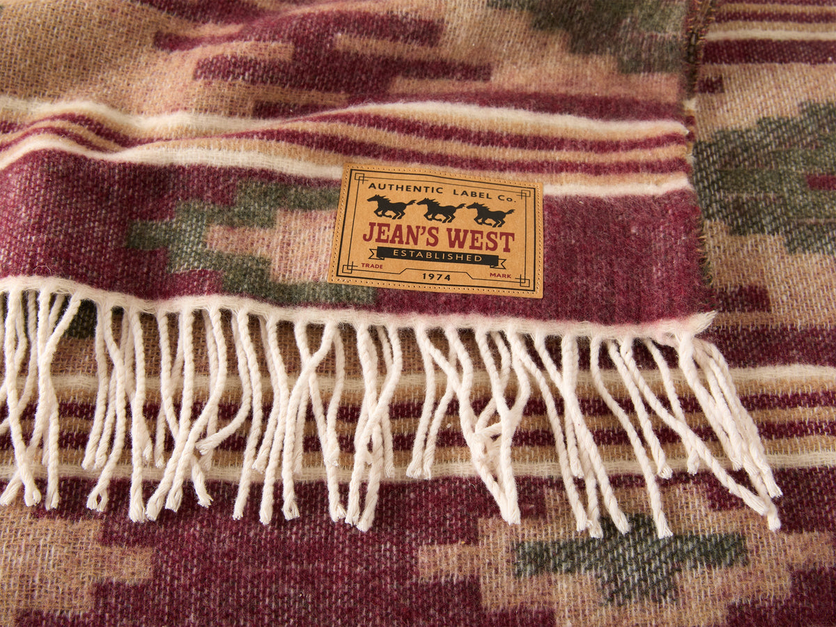 Coperta jacquard con frange