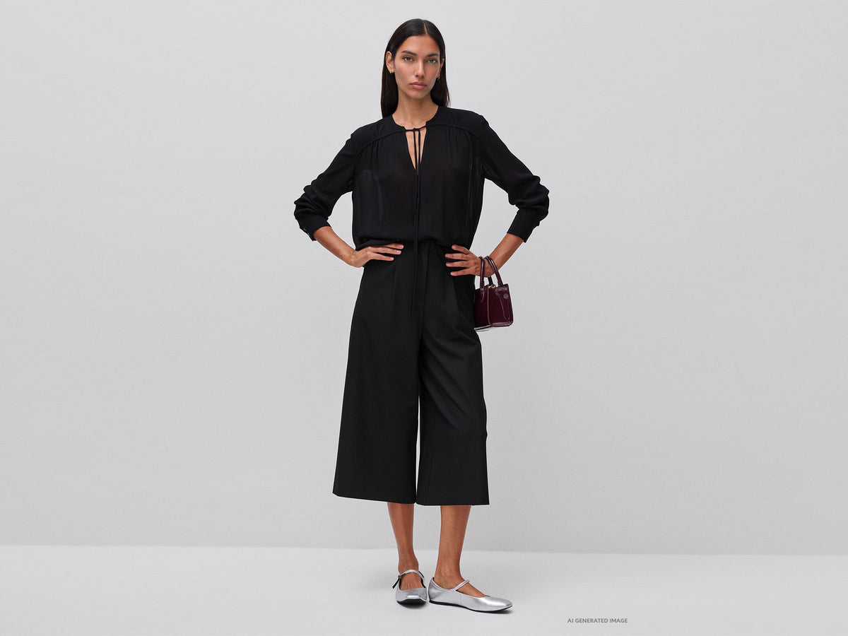 Blusa fluida con laccetto