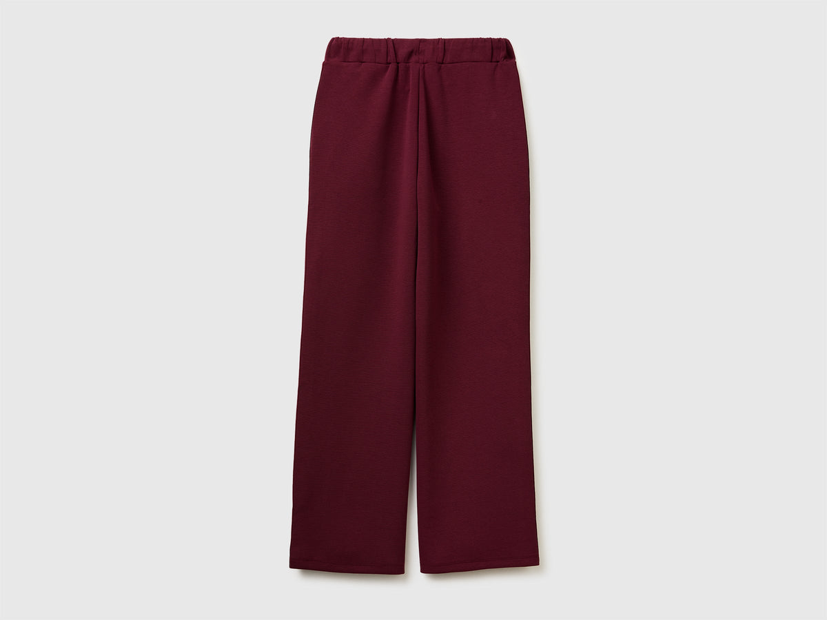 Pantaloni con bande laterali rigate