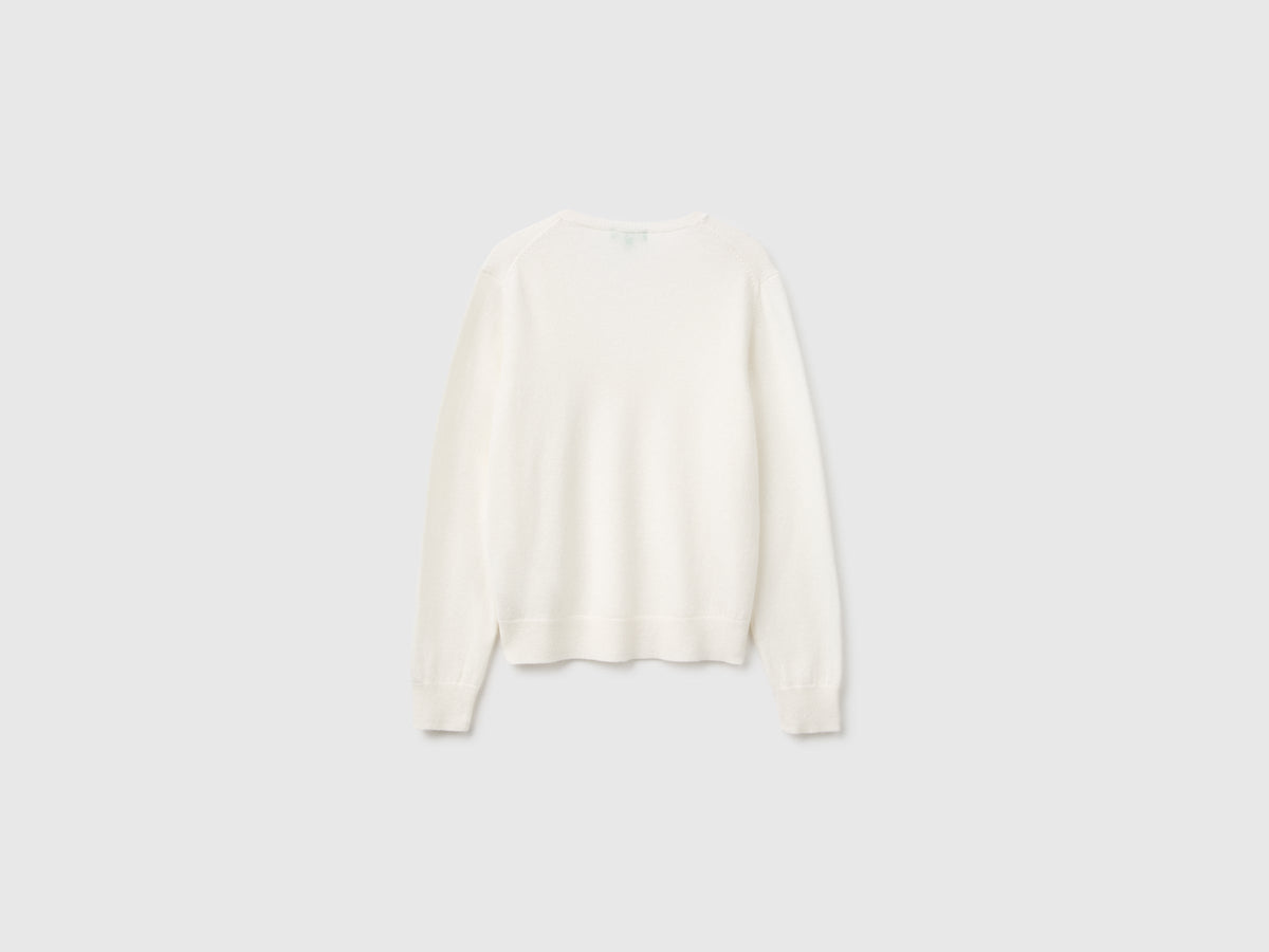 Maglia scollo a V panna in pura lana Merino