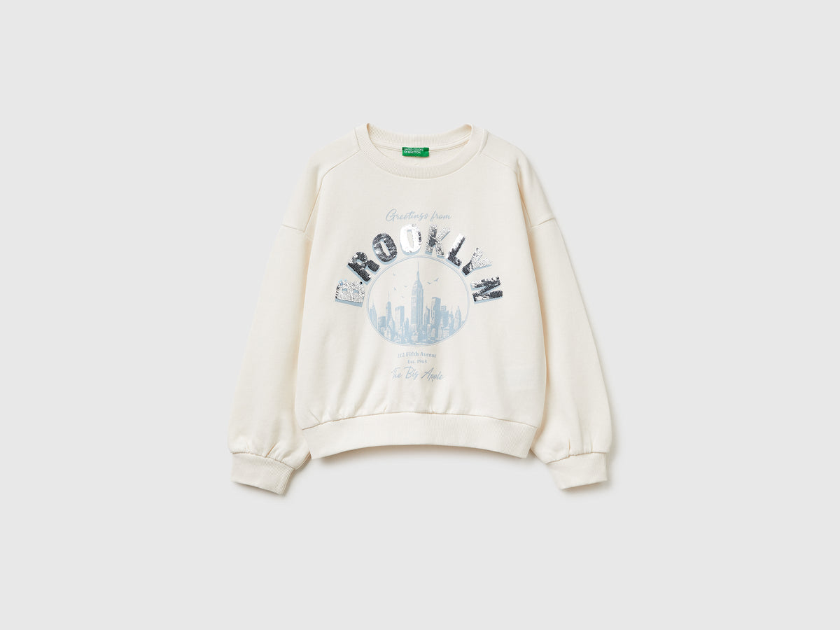 Felpa con stampa e paillettes