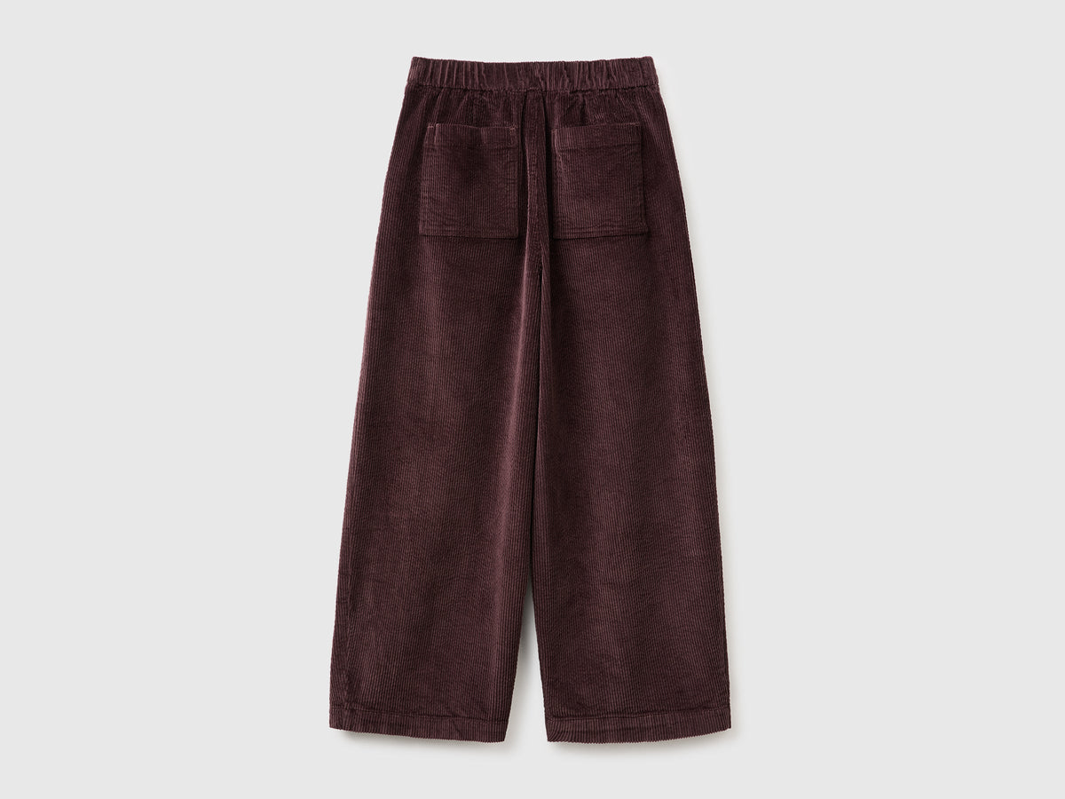 Pantaloni ampi cropped in velluto a coste