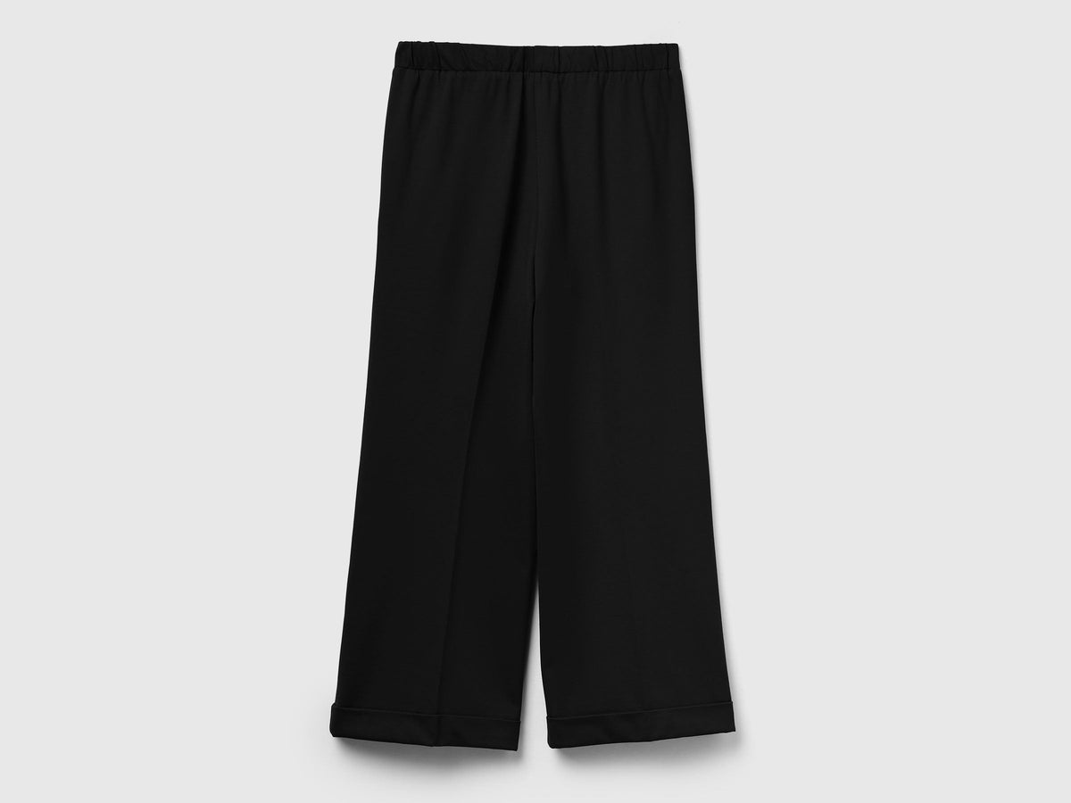 Pantaloni con elastico in vita e risvolto