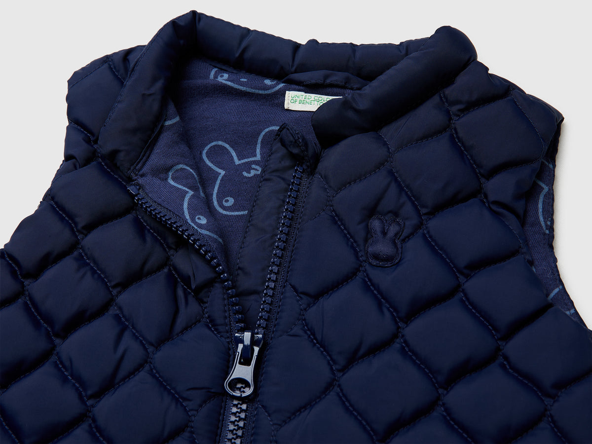 Piumino smanicato con zip