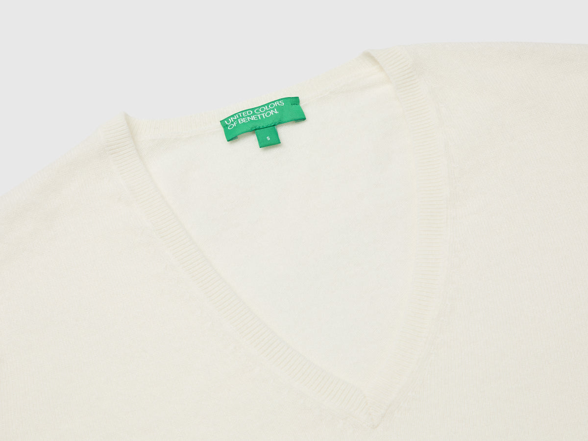 Maglia scollo a V panna in pura lana Merino