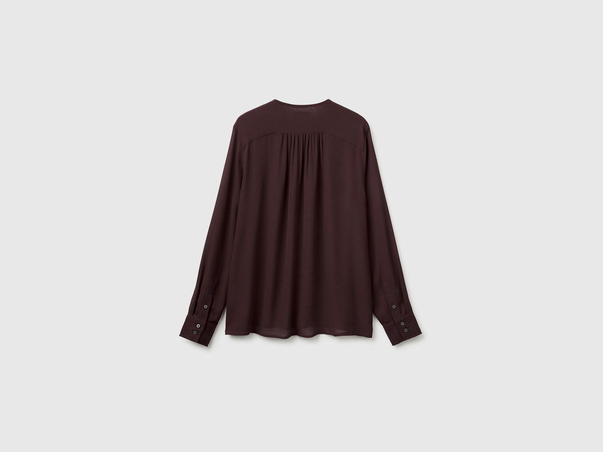 Blusa fluida con laccetto