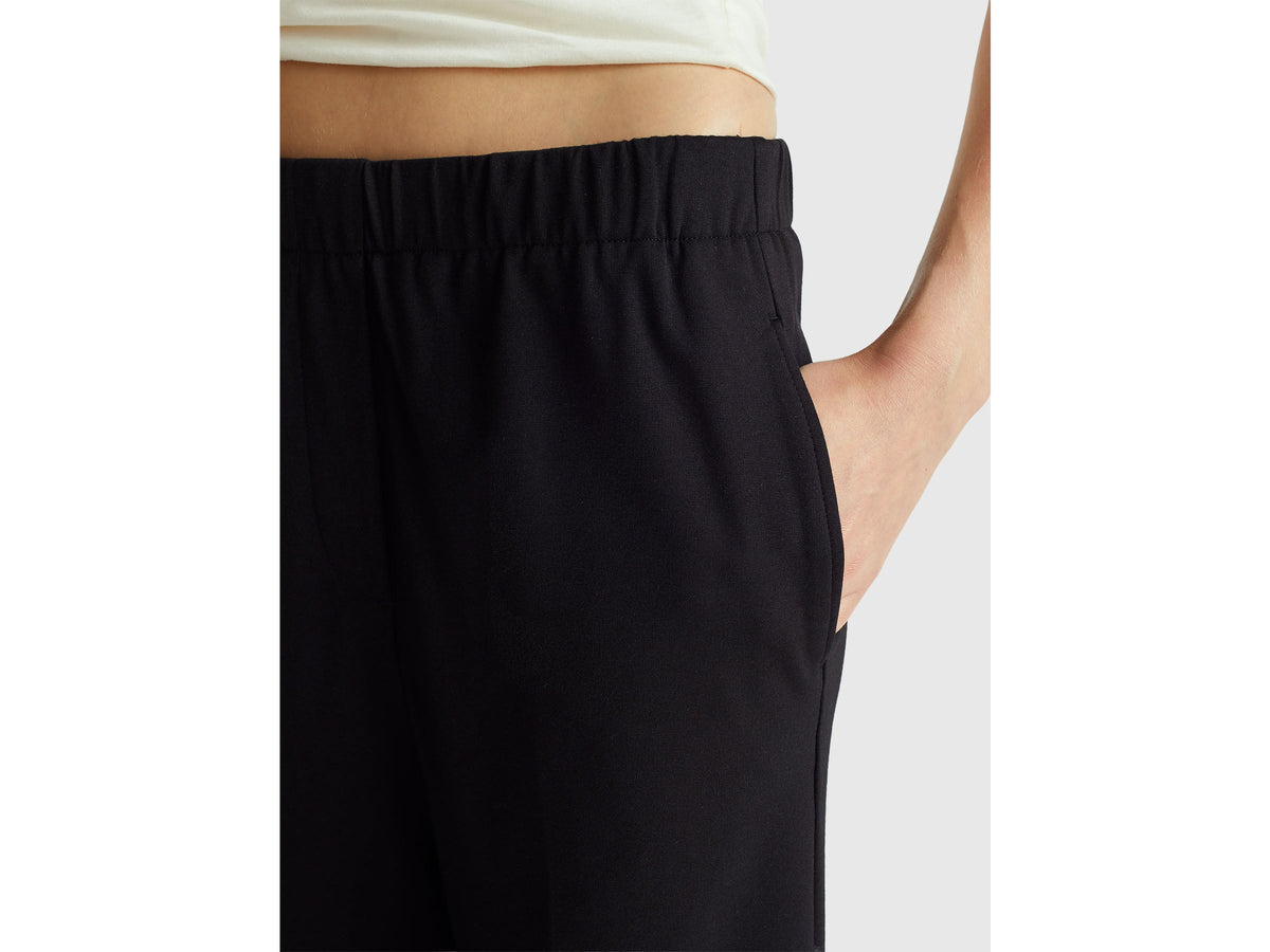 Pantaloni con elastico in vita e risvolto