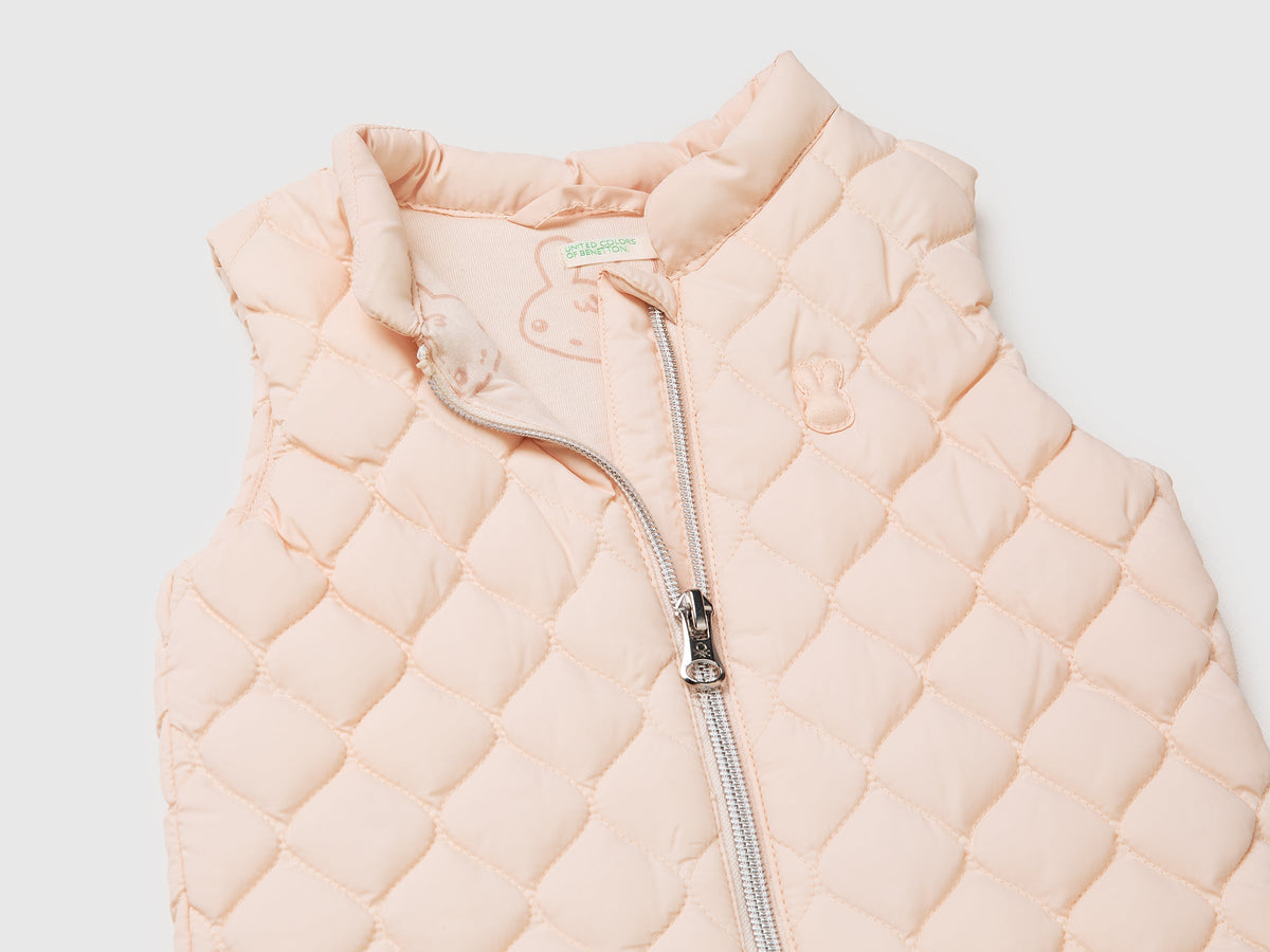 Piumino smanicato con zip