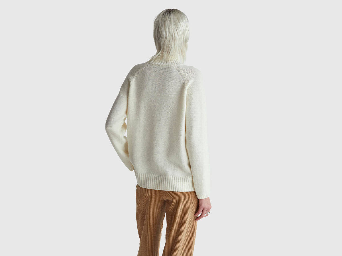Maglione dolcevita over fit con frange