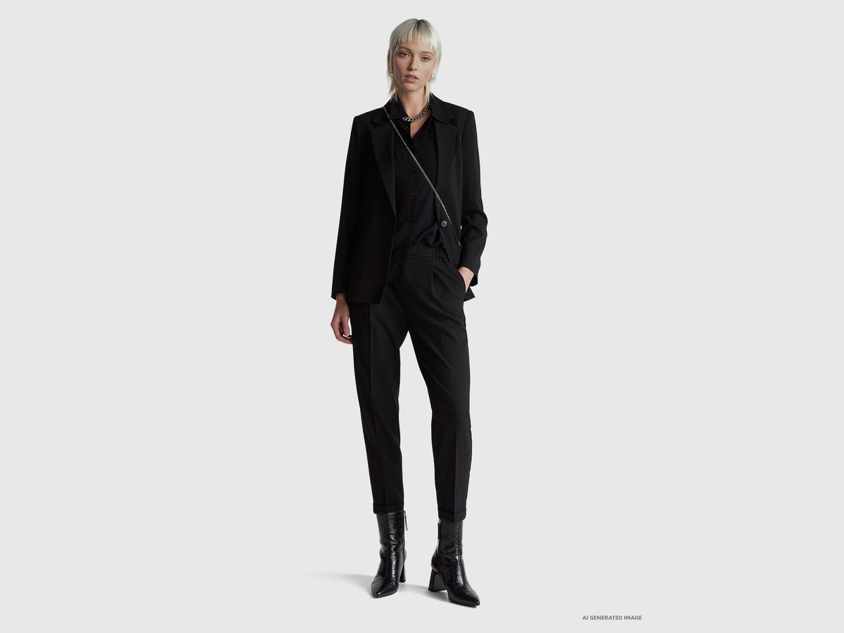 Pantaloni con risvolto in misto viscosa stretch