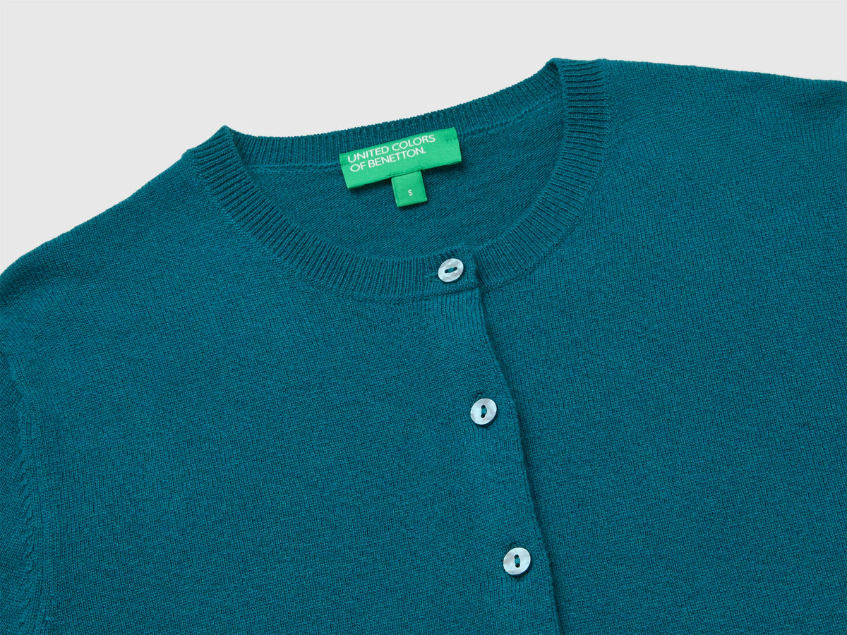 Cardigan girocollo ottanio in pura lana Merino