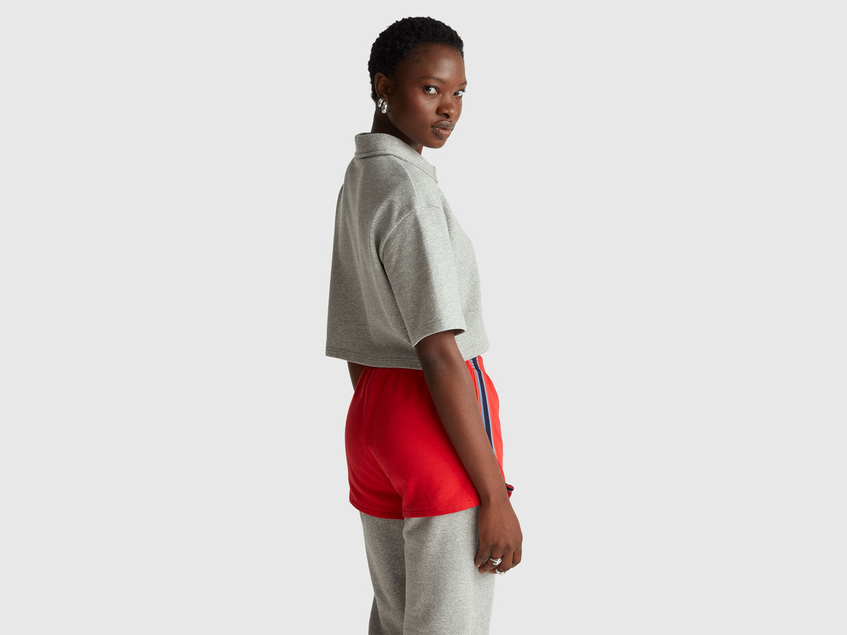 Polo cropped con zip Stranger Things