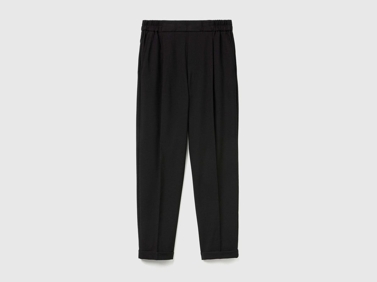 Pantaloni con risvolto in misto viscosa stretch