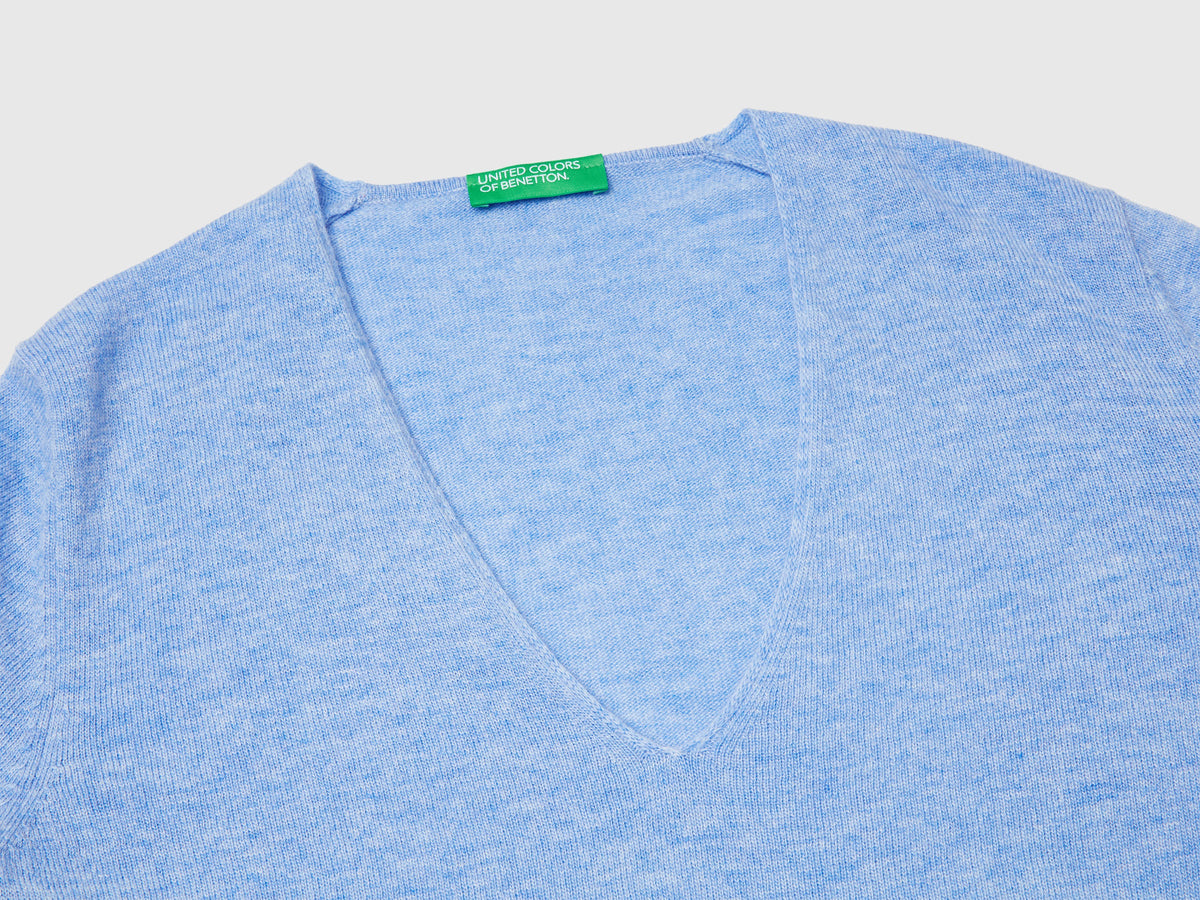 Maglione azzurro con scollo a V in pura lana Merino