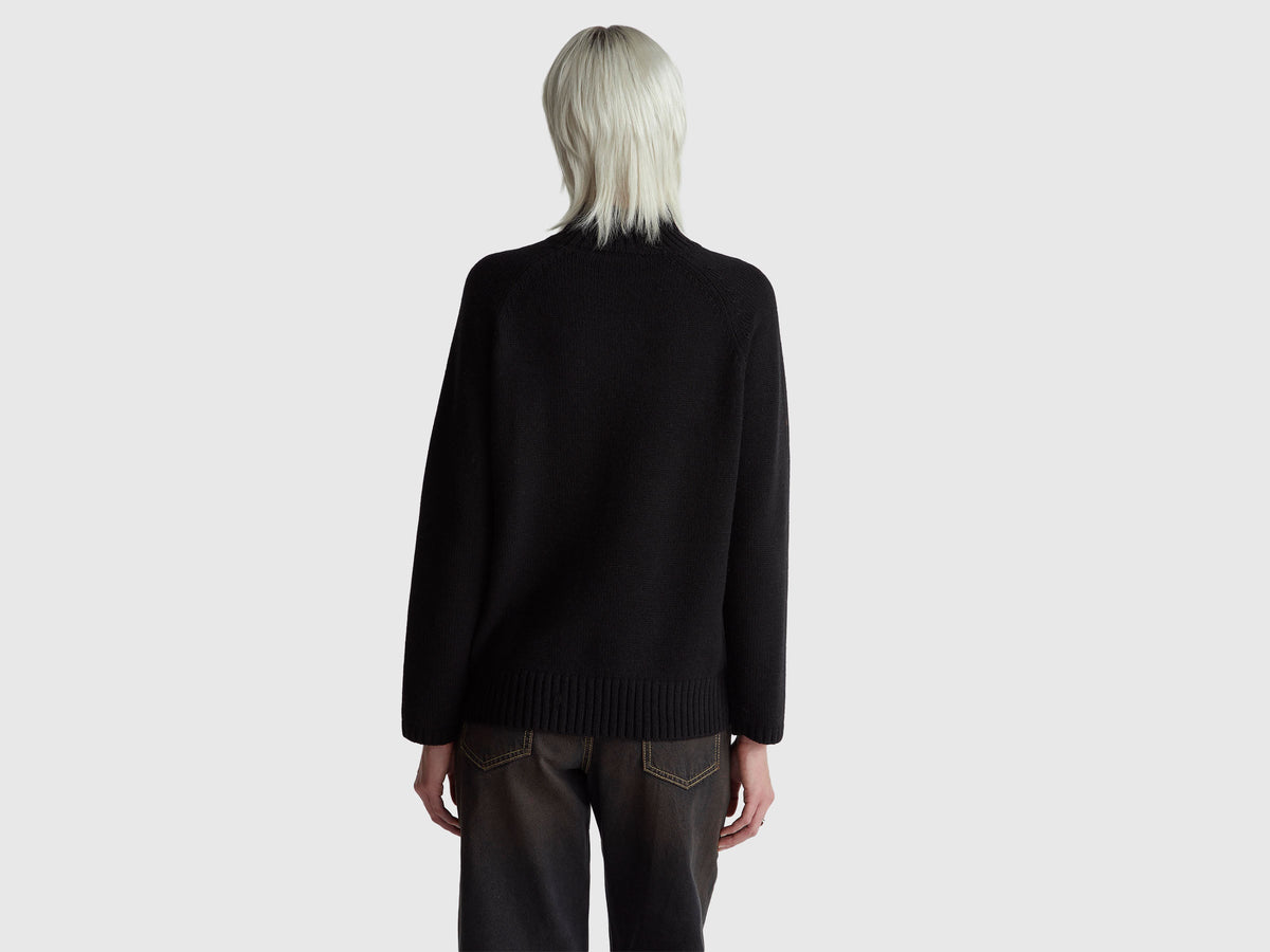 Maglione dolcevita over fit con frange
