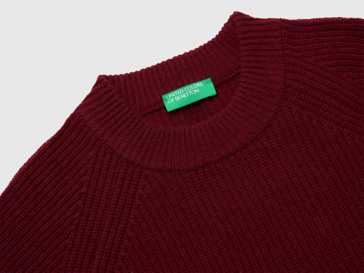 Maglia 100% lana con spacchetti sui fianchi