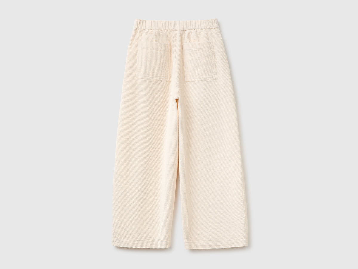 Pantaloni ampi cropped in velluto a coste