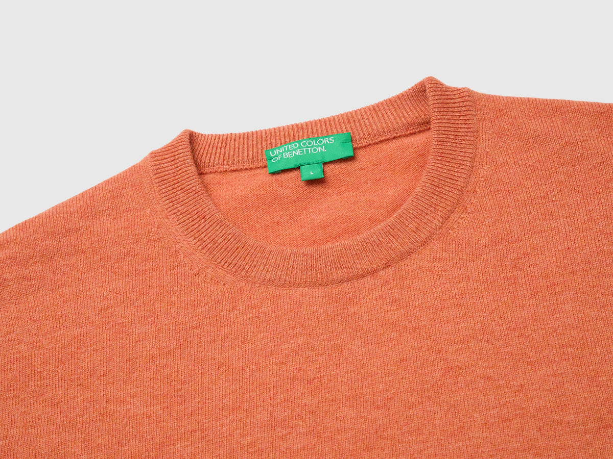 Maglia arancione in pura lana Merino