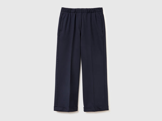 Pantaloni con elastico in vita e risvolto