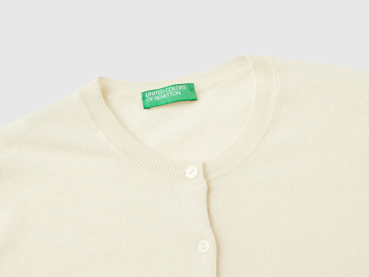 Cardigan girocollo panna in pura lana Merino