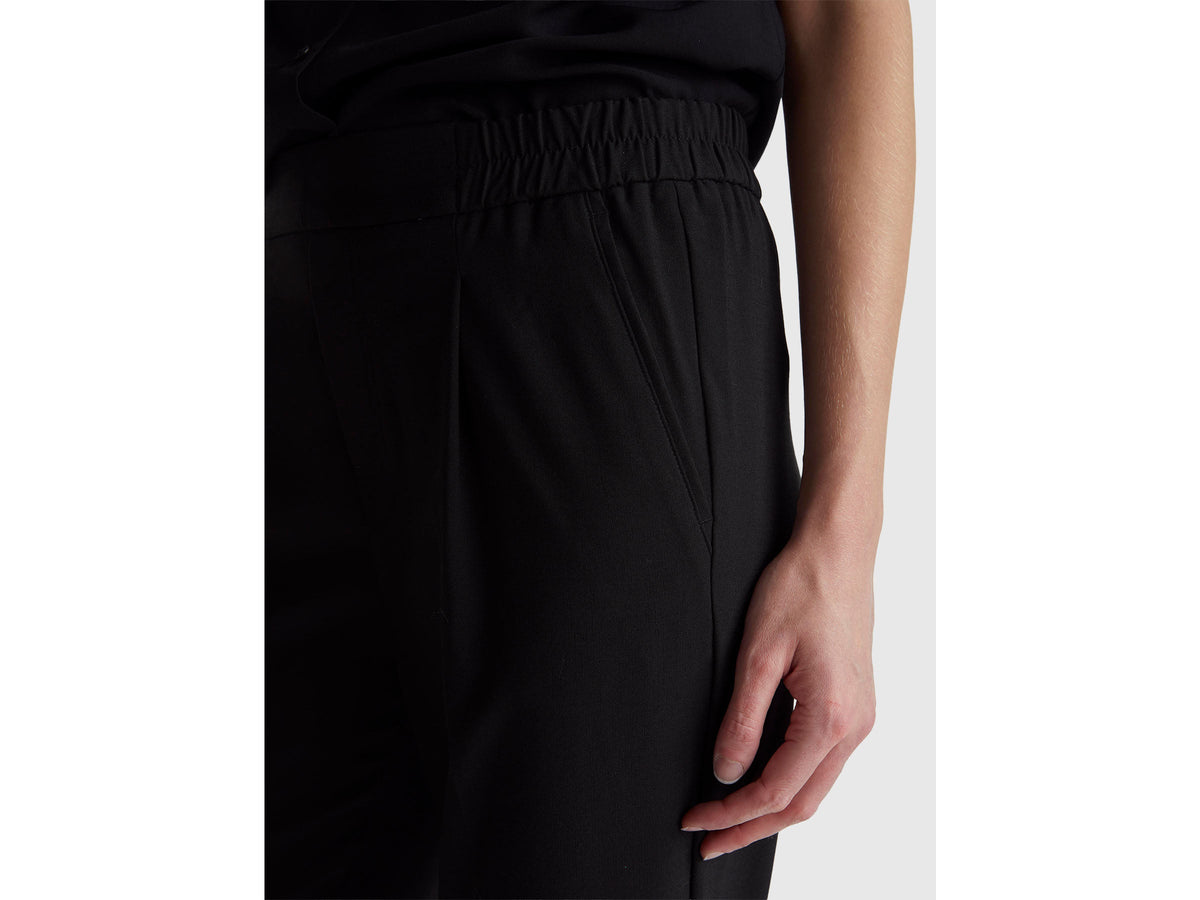 Pantaloni con risvolto in misto viscosa stretch